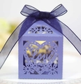 Close-up of lavender laser-cut wedding favor box with Love text and organza ribbon - Sapphire Blue