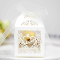 Detail of white laser-cut wedding favor box with Love heart design and satin ribbon bow - Ivory