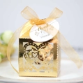 Close-up of golden hollow candy box with laser-cut LOVE heart design and thank you tag - Reflective Gold