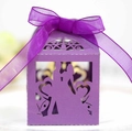 Detail of purple laser-cut wedding favor box featuring romantic couple silhouette and bow - Dark Purple