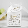 Macro shot of laser-cut white favor box with heart lace pattern and thank you ribbon - White (With Tag)