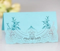 Light blue pearlescent lace place card with intricate laser-cut floral details - Tiffany Blue