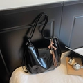 Glossy black hobo shoulder bag in shiny faux leather with brown horse charm - Black with Pendant