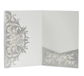 Detail of silver glitter laser cut wedding invitation with intricate rose flower patterns - Silver