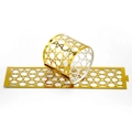 Detail of golden napkin rings with Arabic geometric patterns and slotted closure design - Reflective Gold