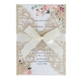 Detail of laser-cut floral wedding invitation with gold glitter cover and satin ribbon bow - Glitter Rose Gold