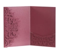 Close-up of laser-cut rose patterns on pearlescent burgundy wedding invitation cover - Dark Red
