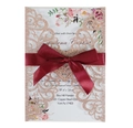 Detail of laser-cut champagne gold glitter wedding invitation with burgundy satin bow - Apple Gold