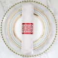 Elegant red laser-cut floral napkin ring with white satin cloth on marble table - Reflective Bright Red