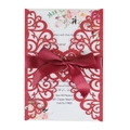 Detail of red glitter laser-cut wedding invitation with burgundy ribbon and floral card - Glitter Red