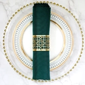 Golden hollow laser-cut napkin ring with ethnic pattern on dark green fabric napkin - Reflective Gold