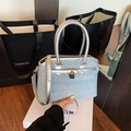 Light blue denim bucket bag with silver leather straps and sparkling rhinestone accents - Silver