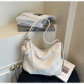 Detail of off-white large tote bag with soft pleated texture and plush bear charm - Off-white