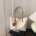 White woven tote bag with brown handles and a cute plush bear pendant accessory - With Charm / White