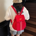 Vibrant red waterproof canvas backpack with yellow embroidery and white drawstring - Burgundy