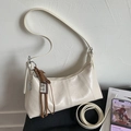 Minimalist beige crossbody hobo bag with braided charm and adjustable shoulder strap - White