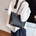 Large black and brown leather tote bag with braided handles and pebble texture - Black
