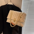 Chic white quilted crossbody bag with gold chain and sphere buckle accessory - Beige