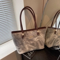 Large smoke gray tote bag with dark brown straps and golden brand logo detail - Gray
