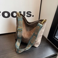 Brown suede tote bag featuring a decorative ethnic-style woven strap and gold hardware - Brown