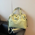 Pistachio green large canvas fitness bag with adjustable shoulder strap and dual front pockets - Green