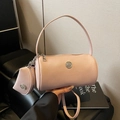 Pink cylinder bucket bag in lychee pattern leather with round coin purse and metal logo - Pink