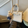 Chic beige lychee leather crossbody bag with adjustable strap and cute bear charm - White with Pendant