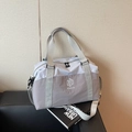Waterproof travel bag in light grey and blue with detachable shoulder strap and dual handles - Gray