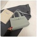 Mint green pebble leather handbag with metal twist lock and adjustable shoulder strap - Blue Without Charm