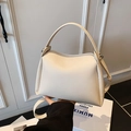 Elegant cream white lychee grain leather handbag with silver hardware and top handle - White