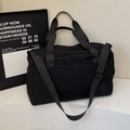 Black large capacity minimalist travel duffel bag with shoulder strap and handles - Black