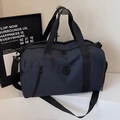 Navy blue large travel duffle bag with adjustable strap and front zipper pocket - Blue
