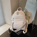 White pebbled leather backpack with a decorative wide strap and mini round purse - Off White