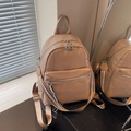 Chic khaki pebbled leather backpack with silver zippers and woven shoulder strap - Khaki
