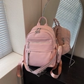 Pink minimalist faux leather backpack with woven strap and small round pouch - Pink
