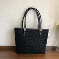 Borsa tote nera con stampa leopardata testurizzata e anelli in metallo argento - Nero
