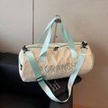 Beige and mint green travel duffel bag with double zipper and adjustable strap - Green