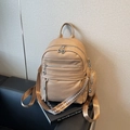 Minimalist beige lychee leather backpack with decorative strap and small round coin purse - Khaki