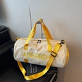 Cylindrical travel fitness bag in cream canvas with vibrant yellow straps and handles - Yellow