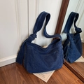 Large dark blue denim tote bag with wide knotted strap and practical front pocket - Dark Blue