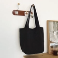 Minimalist black canvas tote bag with front V-pocket and long shoulder straps - Black
