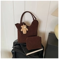 Close-up of brown suede tote bag with matching inner pouch and plush bear charm decoration - Brown