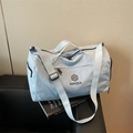 Light blue nylon travel duffel bag with large capacity and adjustable strap - Blue