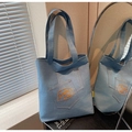 Detail of light blue denim tote bag with orange #today mood embroidery on the front pocket - Light Blue