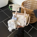 Cream crossbody bag with purple lettering and a large white plush bunny charm accessory - Multicolor With Charm
