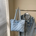 Light blue quilted puffer tote bag with diamond stitching and wide shoulder strap - Blue