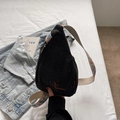 Black casual chest bag featuring colorful floral embroidery strap and orange logo - Black