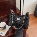 Quilted black bucket bag with silver chain strap and polished diamond pattern finish - Large / Black