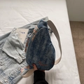 Retro denim blue crossbody chest bag with ethnic pattern embroidery strap on white bed - Blue