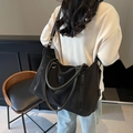 Black waterproof nylon travel duffel bag with leather handles and detachable shoulder strap - Black